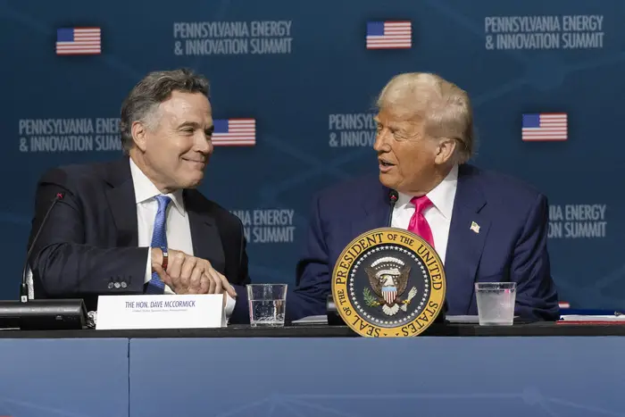 Trump shakes hands with Sen. McCormick.