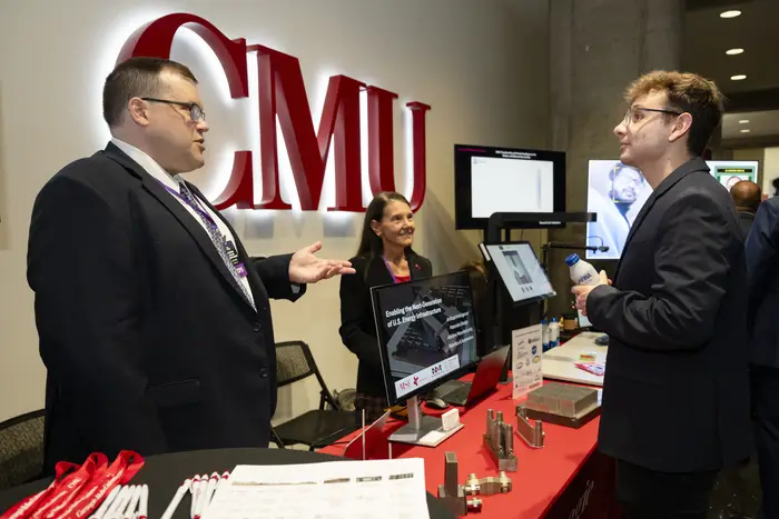 A CMU booth at the summit.