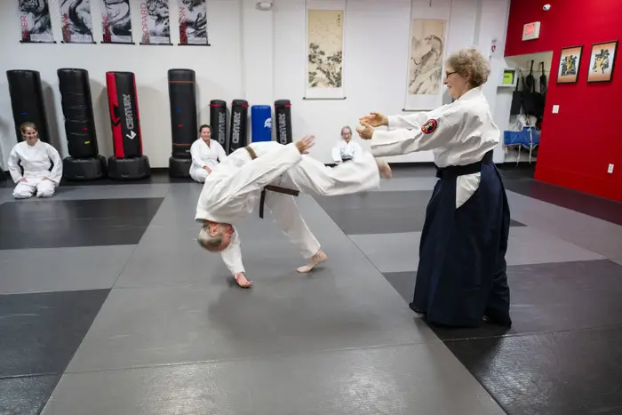 Barbara Litt performs an aikido throw. 