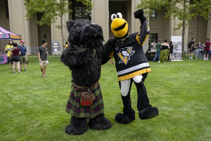 CMU's Scotty and the PGH Penguin's mascot Iceburgh.