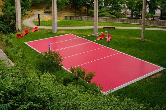 Red volleyball court on campus