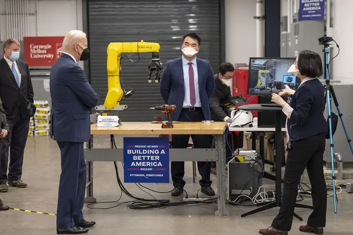 President Biden listens to a demo