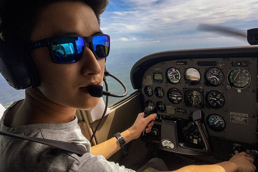 Jack Wang in cockpit piloting plane