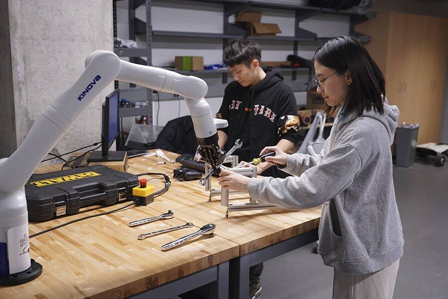 Students working with a robot