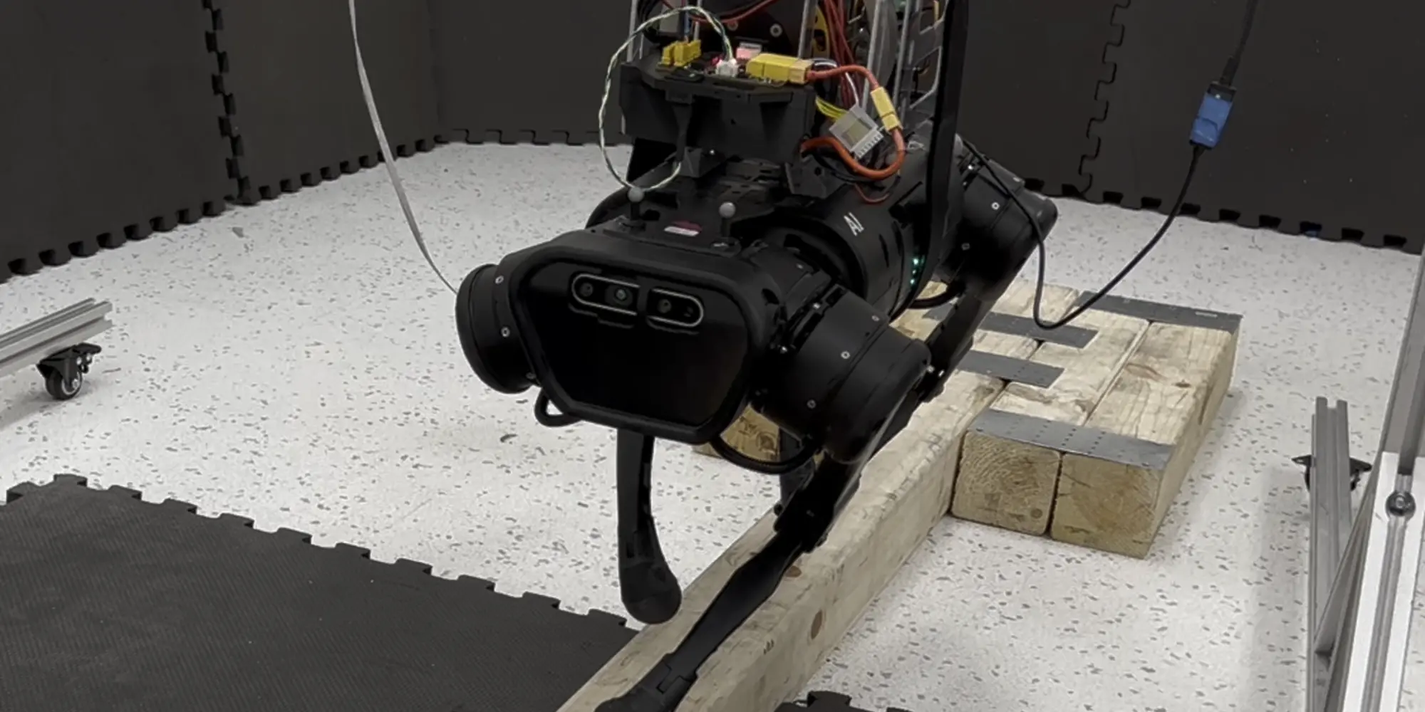 four-legged robot balancing on a beam