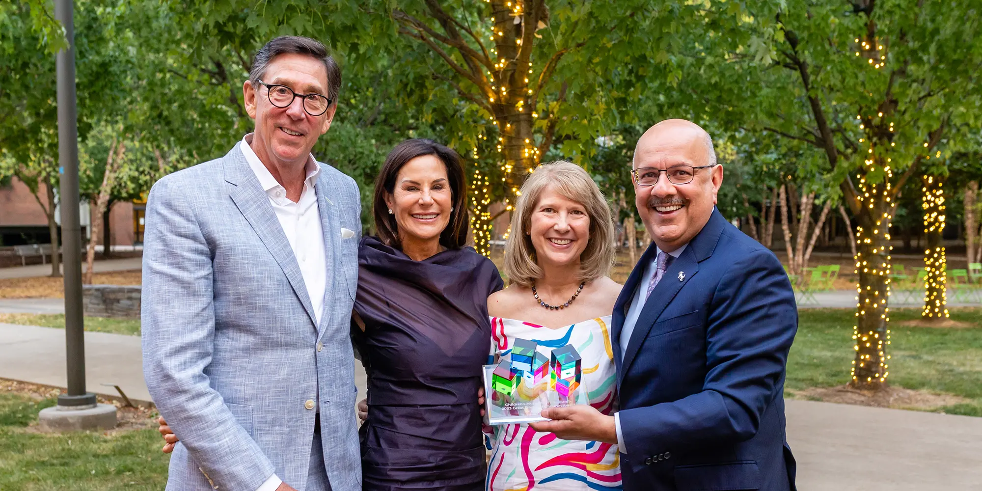 Four people standing outdoors