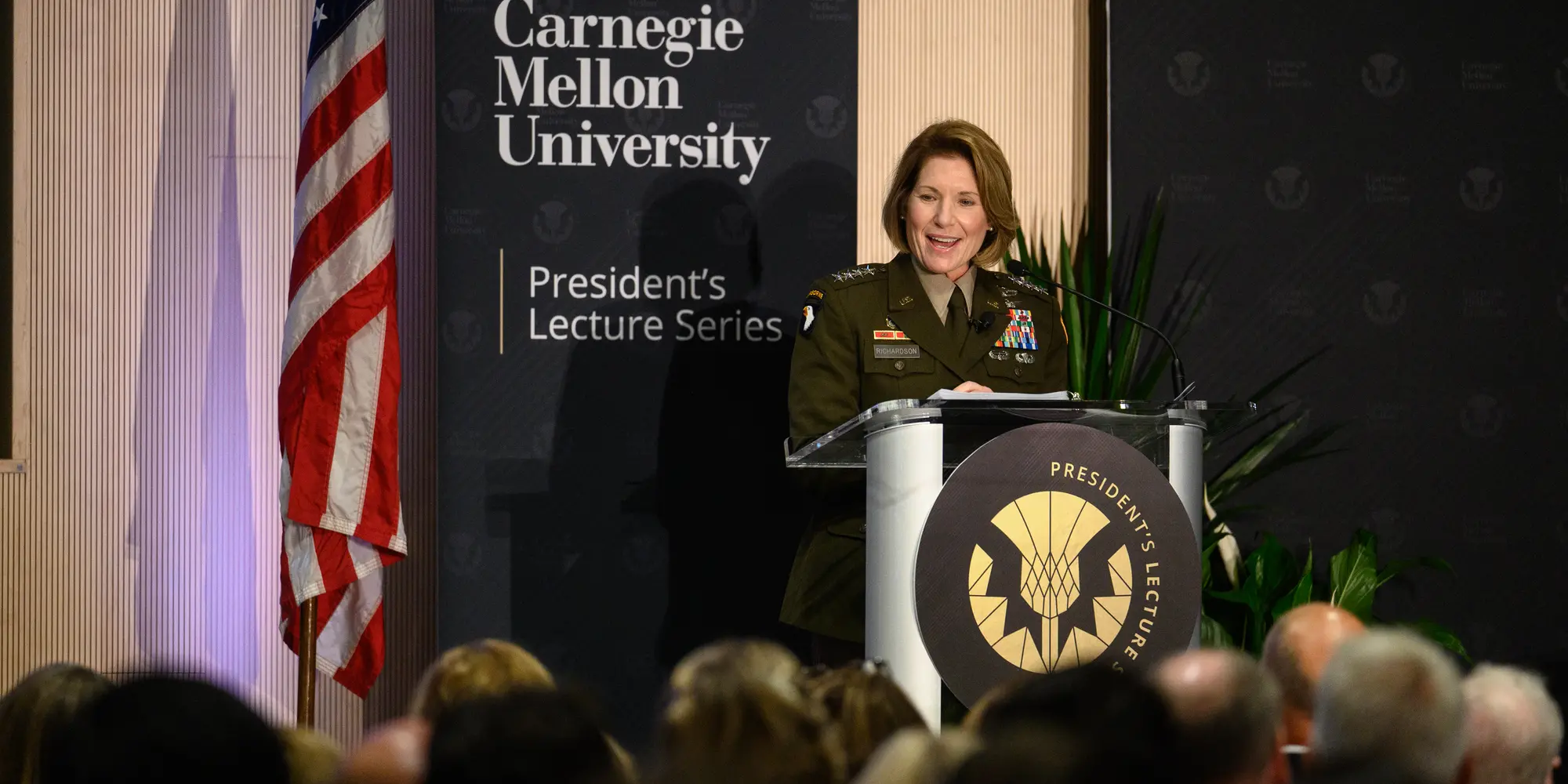 General Richardson standing behind podium