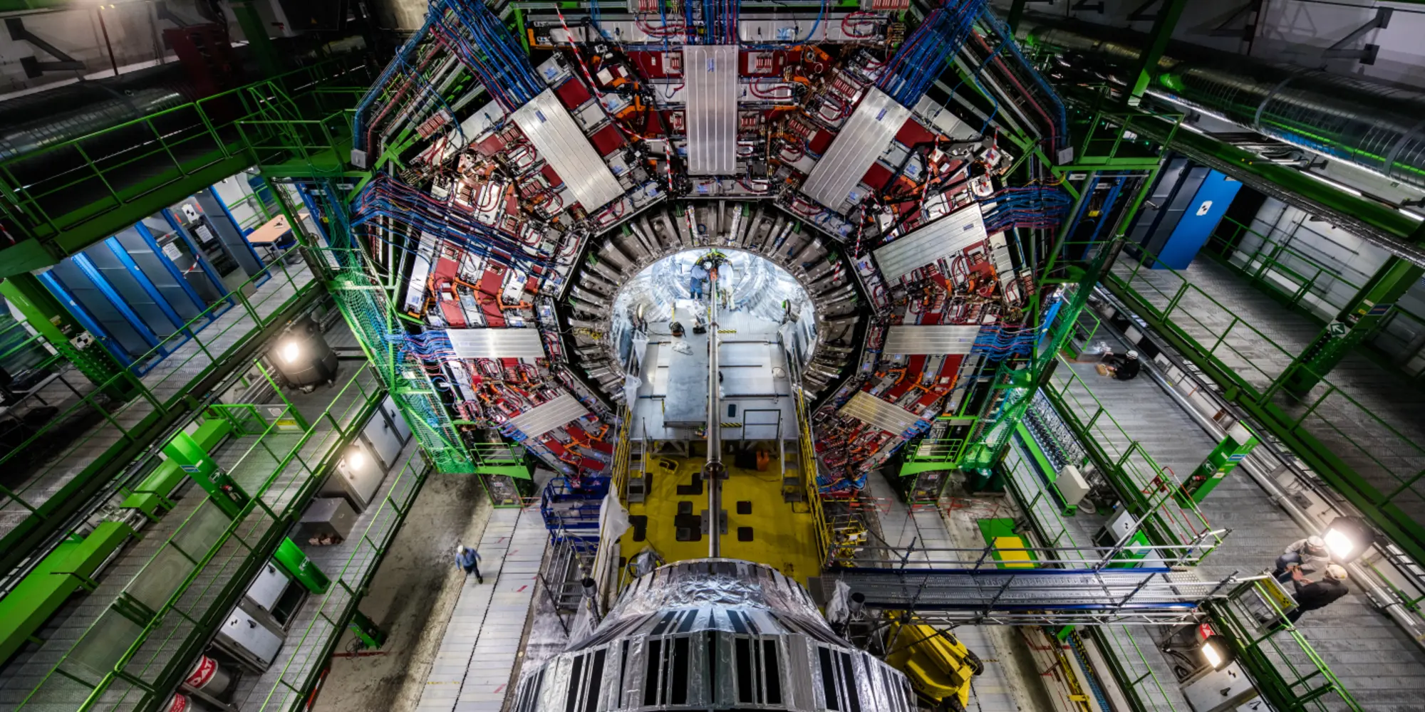 physicists and engineers replace the heart of the Large Hadron Collider’s Compact Muon Solenoid experiment. Photo courtesy of CERN