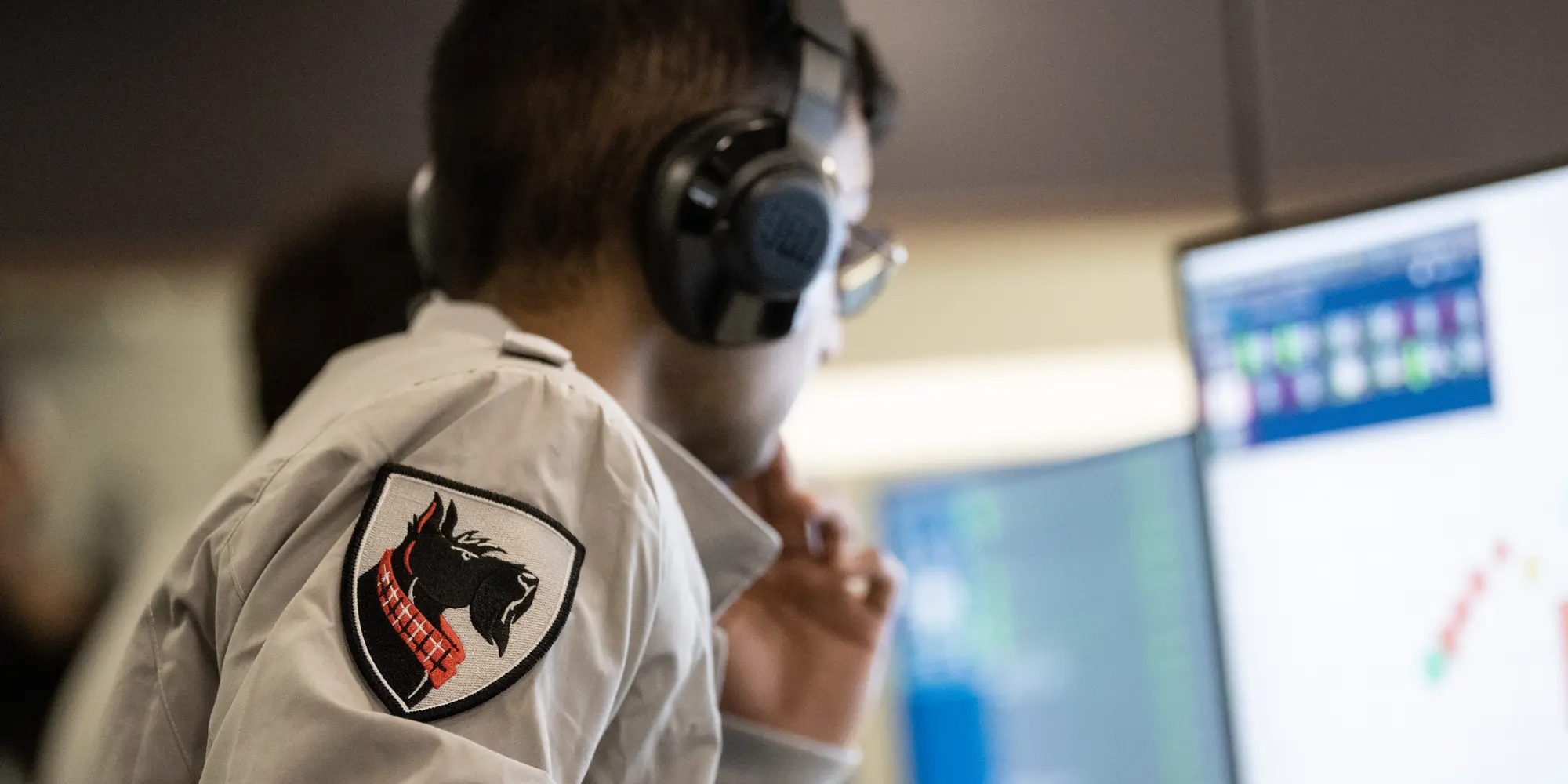 A student looks at a computer.