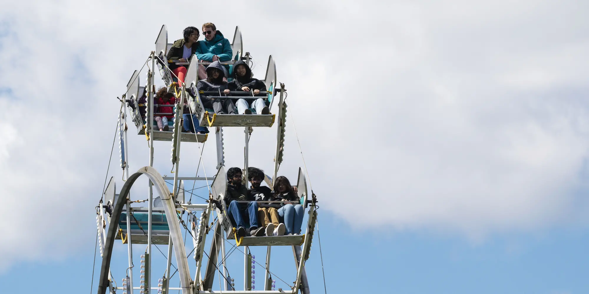 People on a ferris wheel.