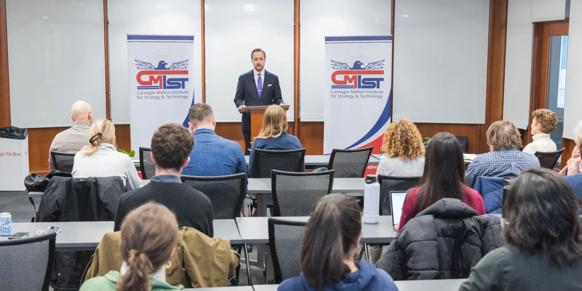 Harry Krejsa speaks at the front of a classroom 
