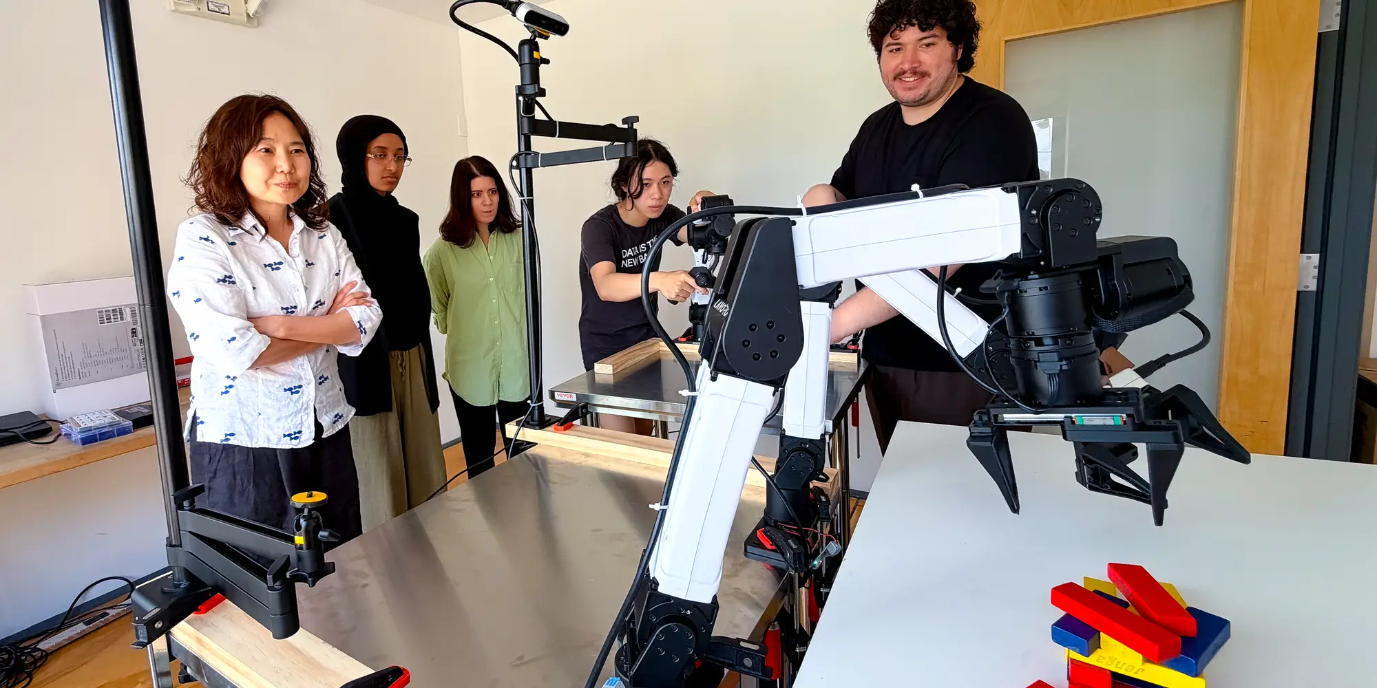 Researchers set up and operate robotic arms using RIO’s unified interface for robot control and teleoperation.