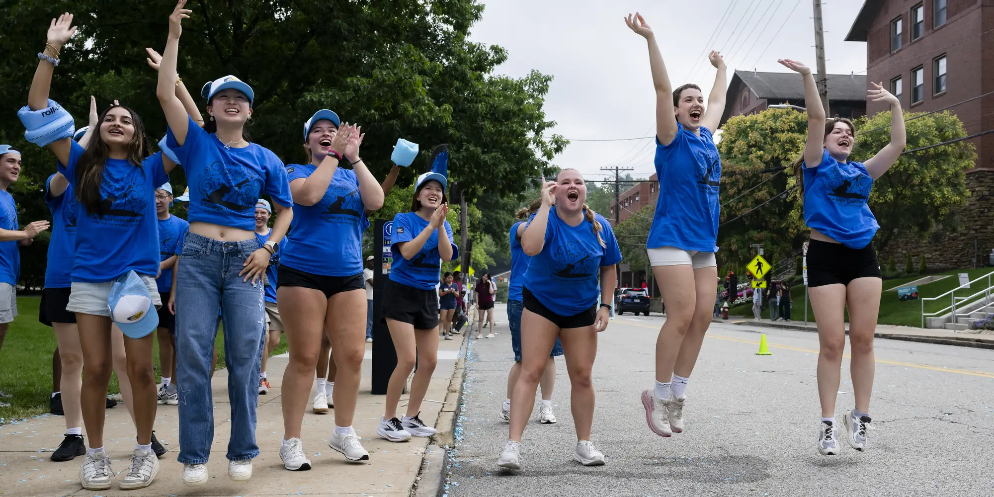 At move in, CMU student volunteers jump up and down, cheering on incoming members of the new class
