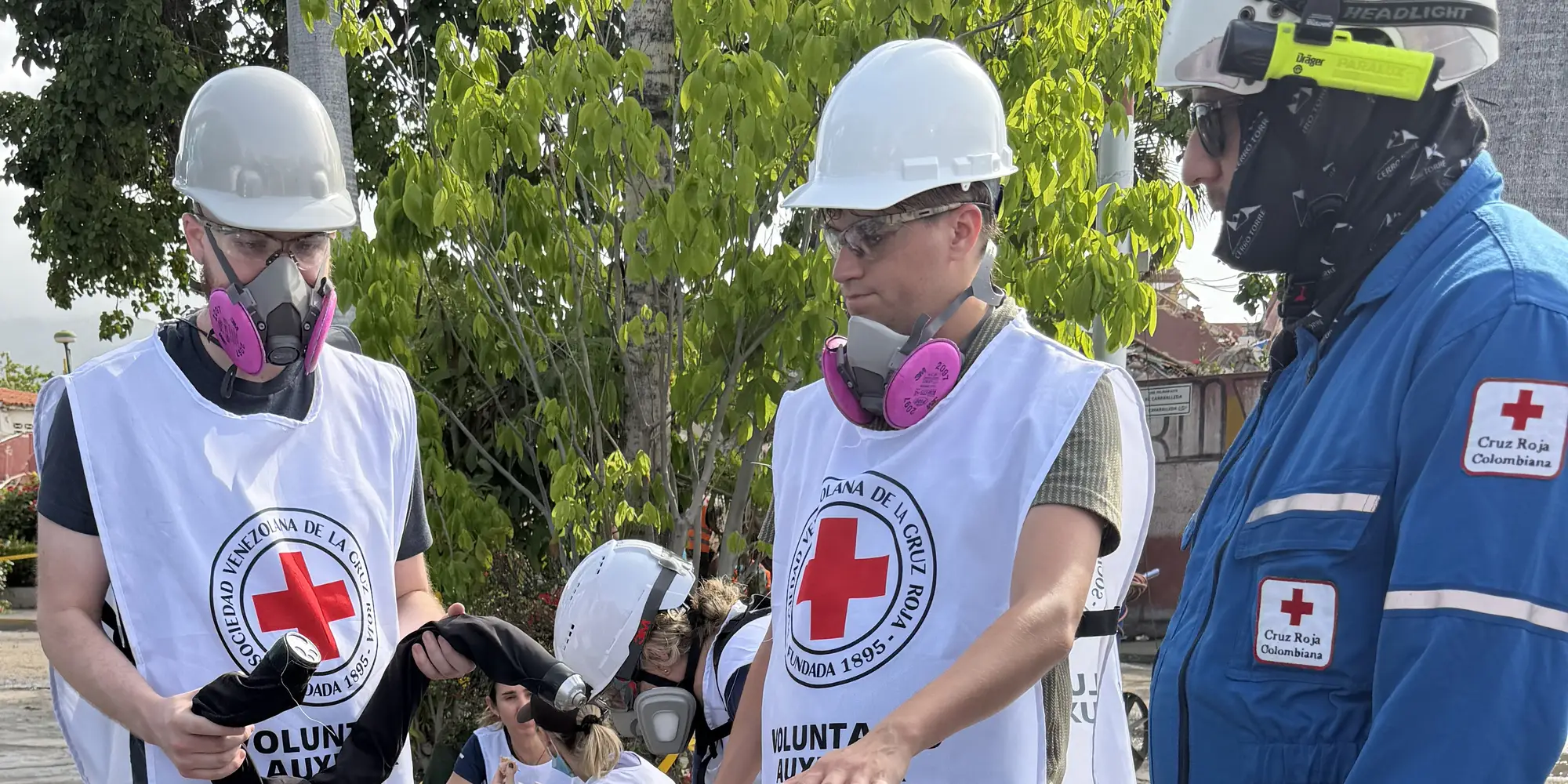 Darwin Mick and Nico Zevallos-Roberts, members of the Biorobotics Lab at Carnegie Mellon University’s Robotics Institute, show the snake robot to the Colombian Red Cross as they assist with search and rescue efforts following earthquakes in Venezuela.