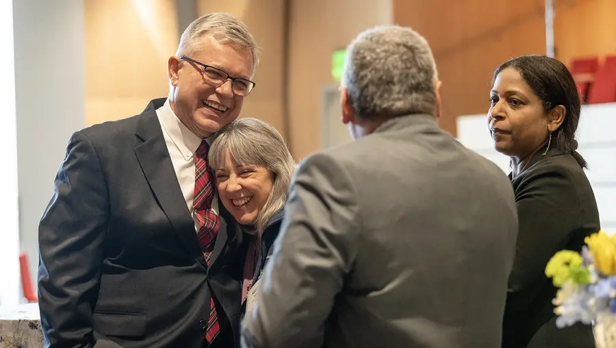 Mike Steidel greets attendees of his retirement party