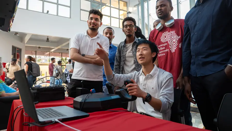 students looking at simulator screen