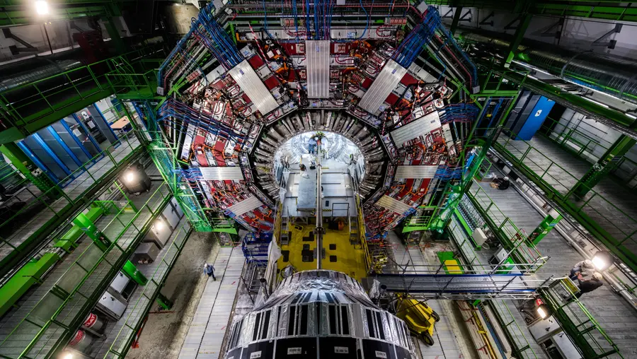 physicists and engineers replace the heart of the Large Hadron Collider’s Compact Muon Solenoid experiment. Photo courtesy of CERN