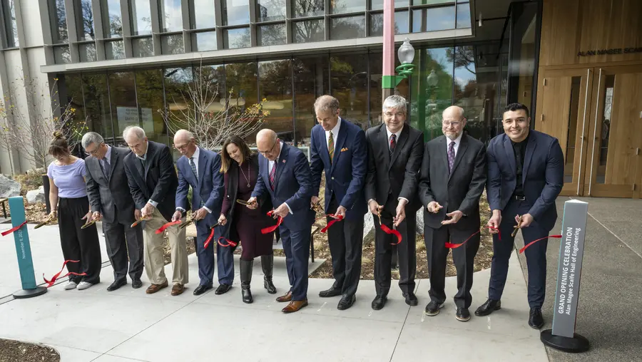 A ribbon cutting at Scaife Hall