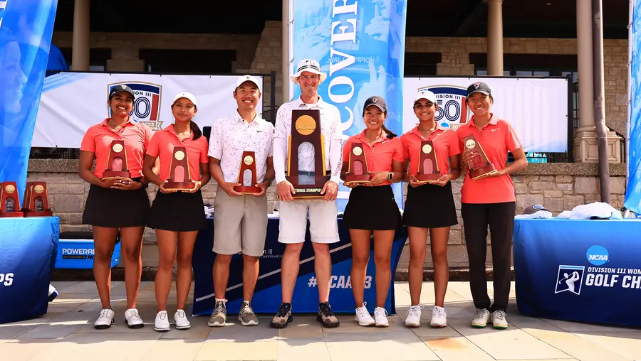 The CMU women's golf team with their championship trophy.