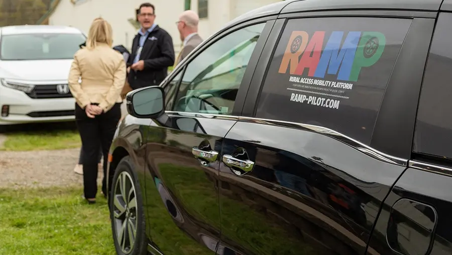 Minivan with the "RAMP" logo