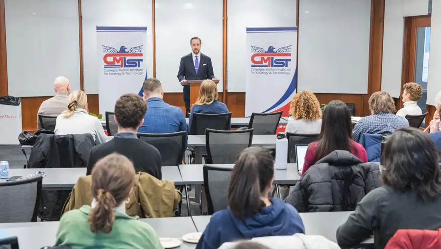 Harry Krejsa speaks at the front of a classroom