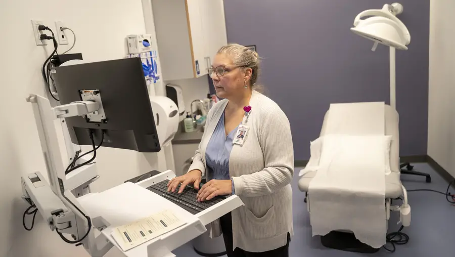 Dr. Andrews working in exam room