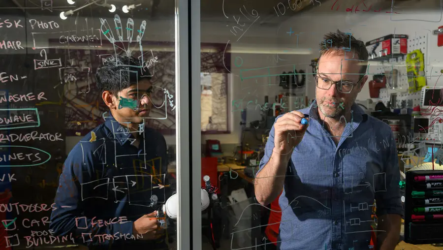 HCI professor Chris Harrison instructs a student.