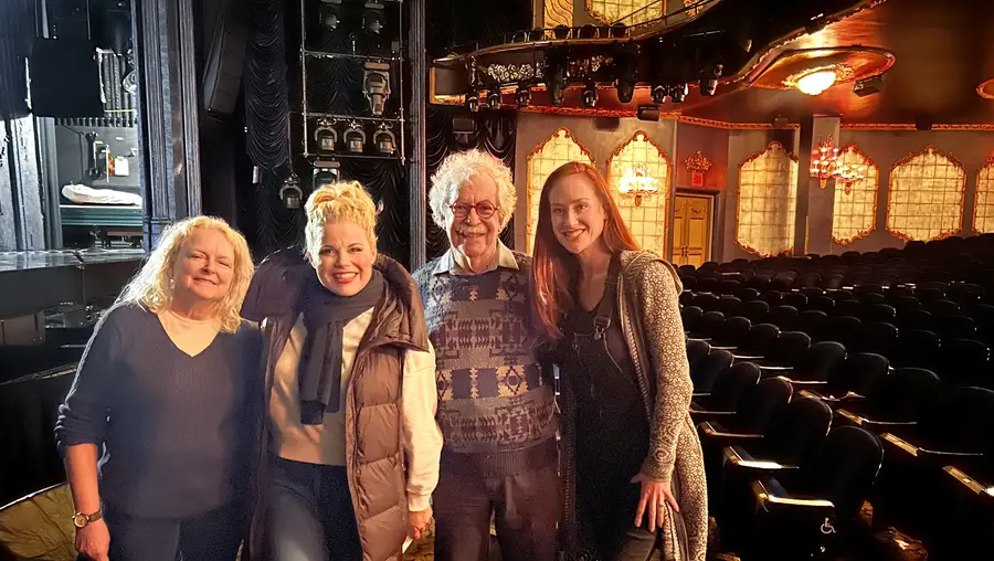 A group photo in a theater