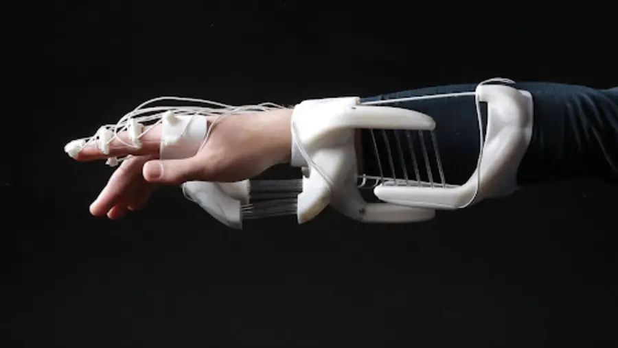 White skeletal-like metastructure worn on a hand and forearm