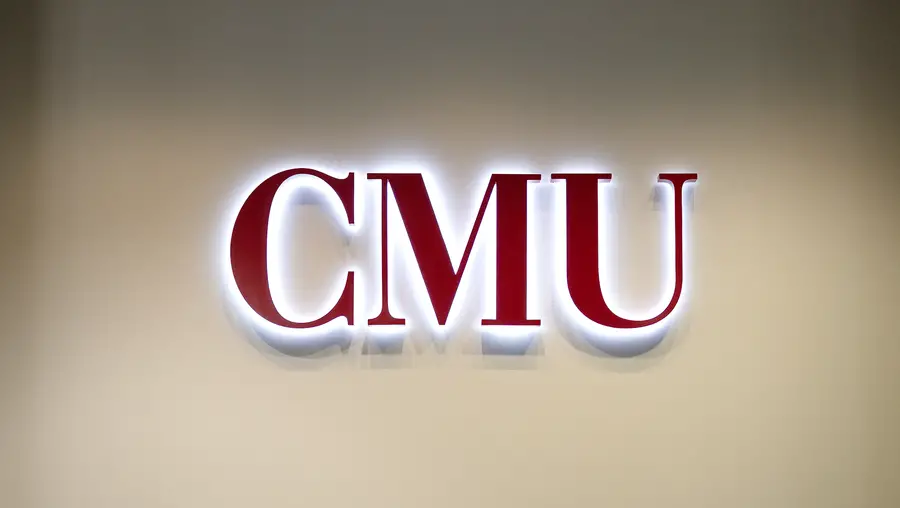 Red CMU letters with light protruding from behind.