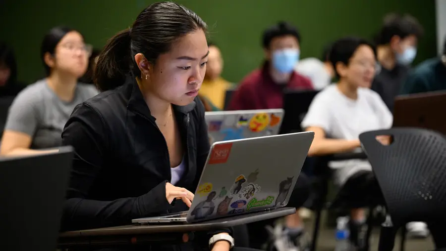 Students take part in their class on mobile apps design and development