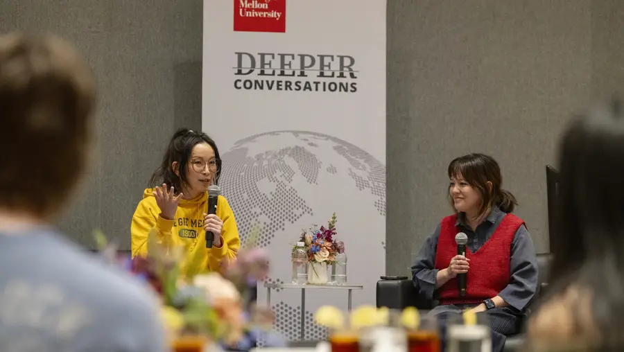 CMU alumnae Tria Chang and Justine Lee speak to a group of students gathered for dinner and a conversation.
