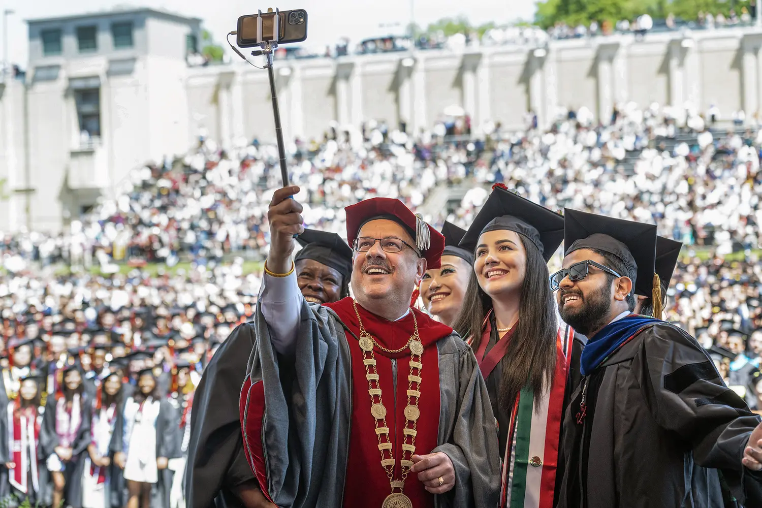 Farnam Jahanian takes a selfie at Commencement