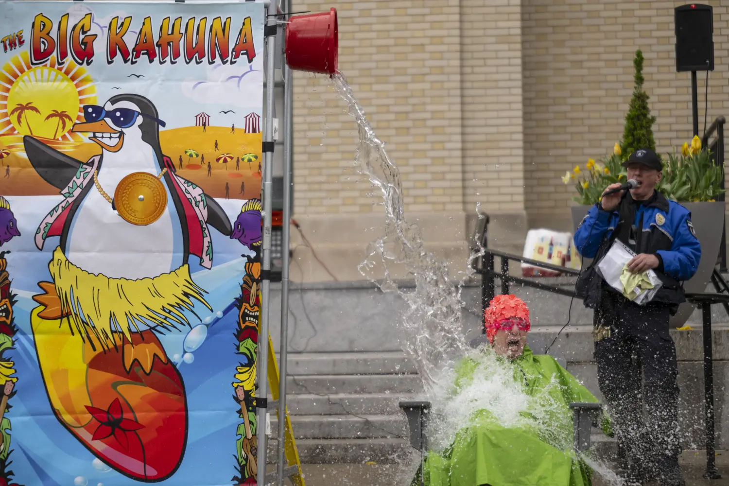 CFA Dean Mary Ellen Poole gets doused with water for a good cause.