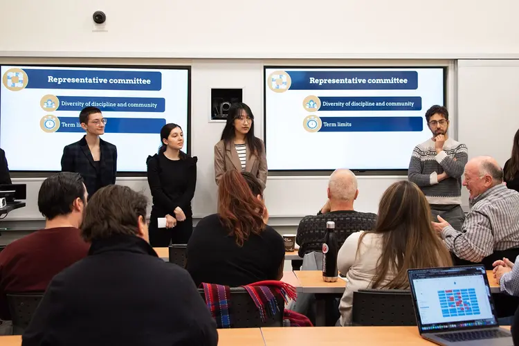 Students presenting at front of classroom