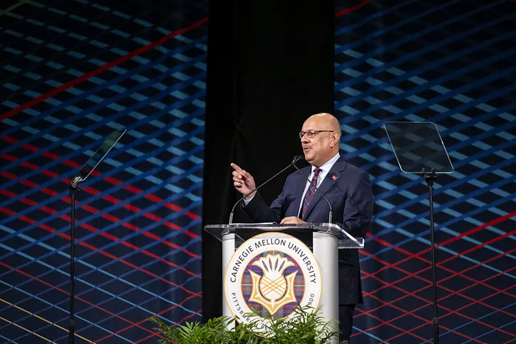 CMU President Farnam Jahanian at podium