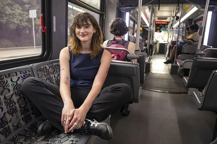 girl seated on bus