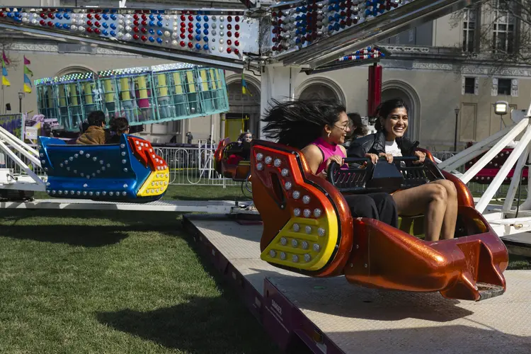 Students enjoying a whizzing carnival ride
