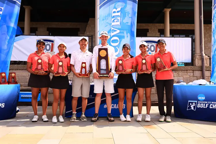 The CMU women's golf team with their championship trophy.