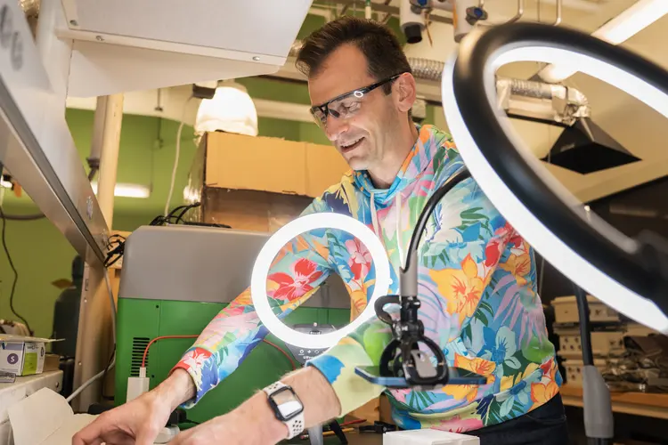 Man in lab wearing colorful shirt