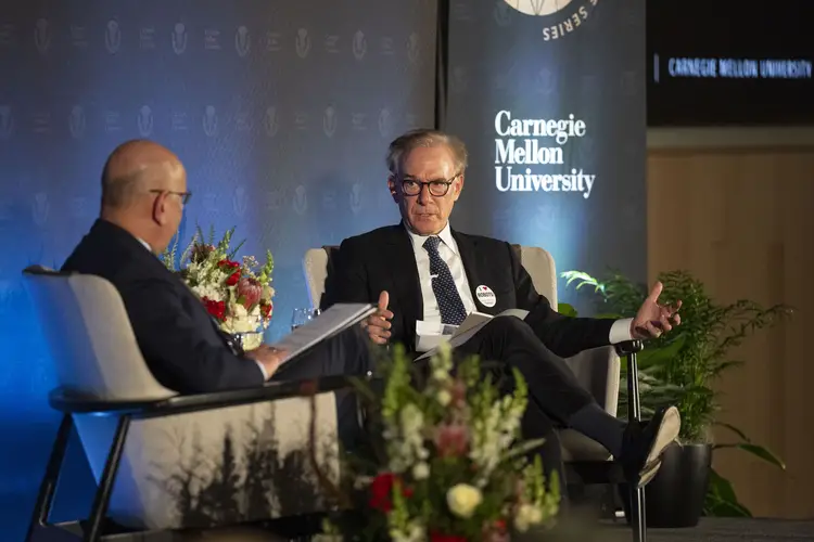Farnam Jahanian and David Ignatius speak together on stage.