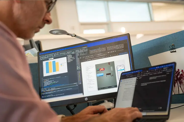 Ph.D. student Allen Brown works on a laptop.