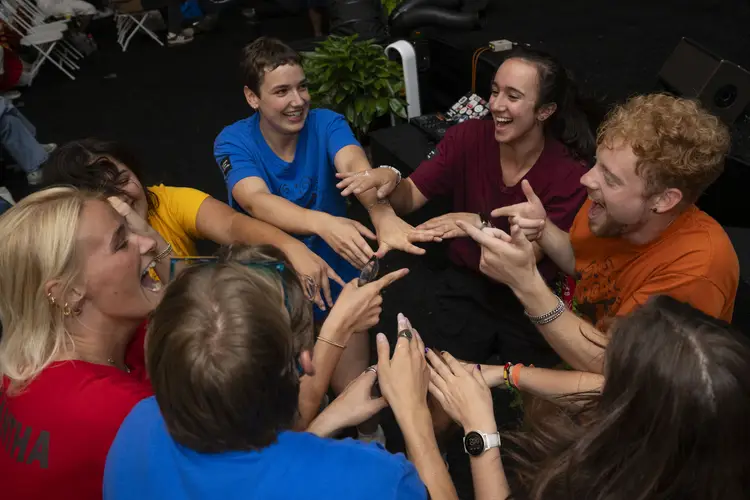 Orientation counselors and volunteers convene at the Community Collage event.