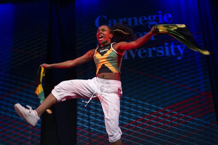 A student performs during the Class of 2030+ Community Collage orientation event.
