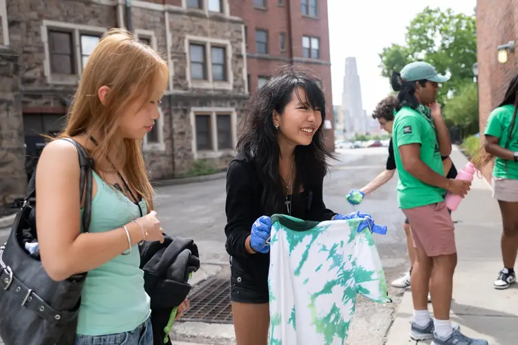 Students tie-dye shirts during a House Day afternoon activity.