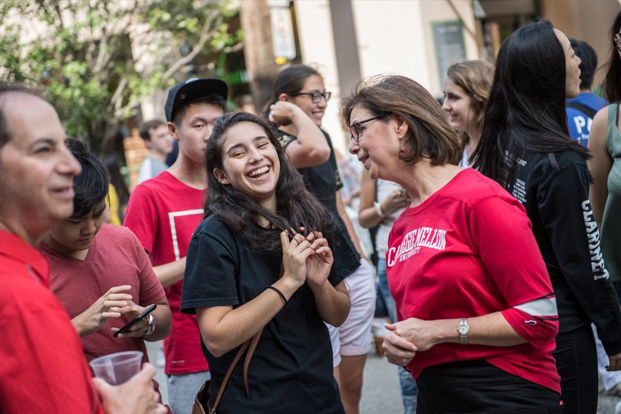 Image of a student talking with Provost Weingart