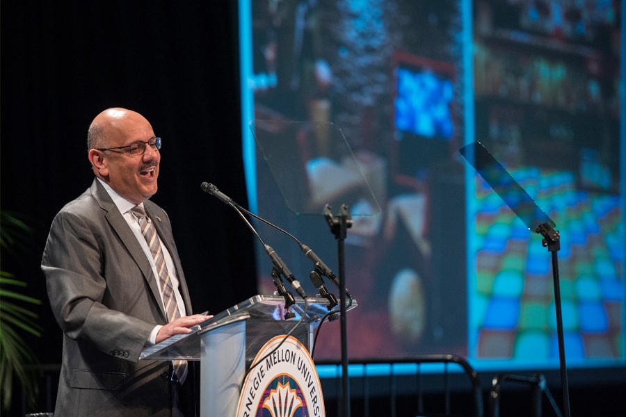 Image of CMU's president speaking to students and families