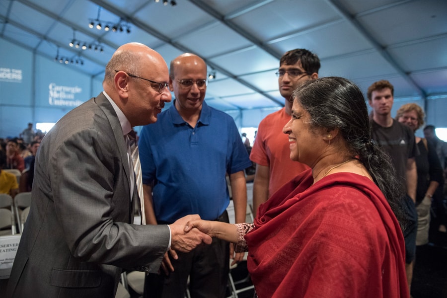 Image of CMU's president greeting a family