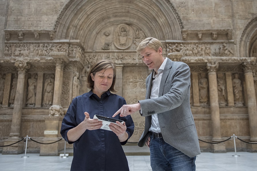 Image of two faculty members standing in the hall of architecture