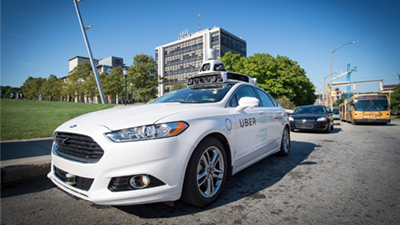 Uber pulling up to campus on Forbes Avenue